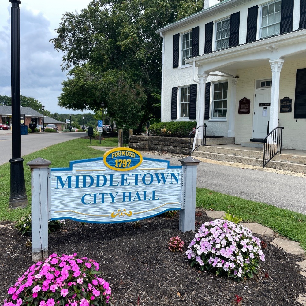 City Hall sign with flowers